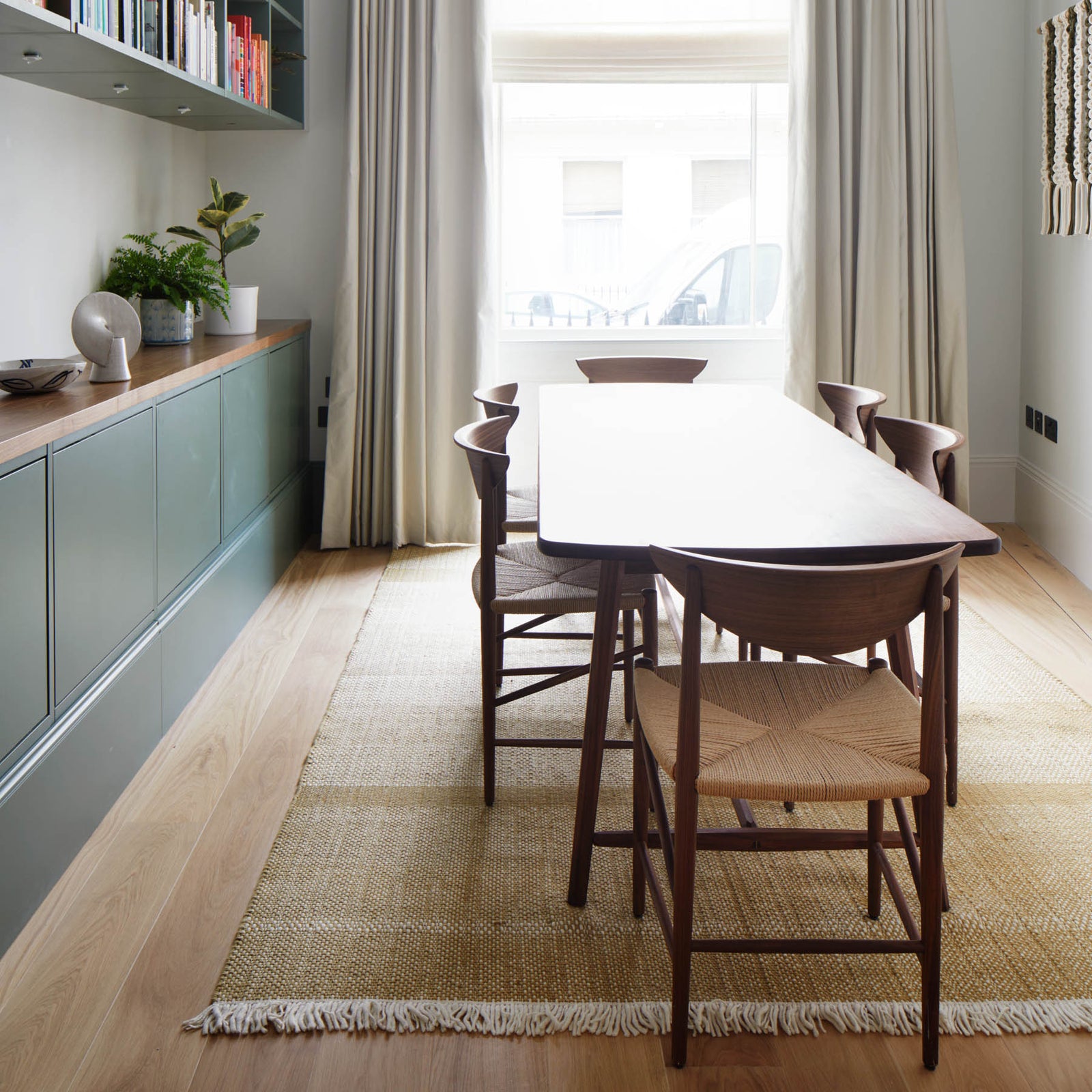 Bespoke walnut table for Inhabit Queens Gardens hotel by Goldfinger