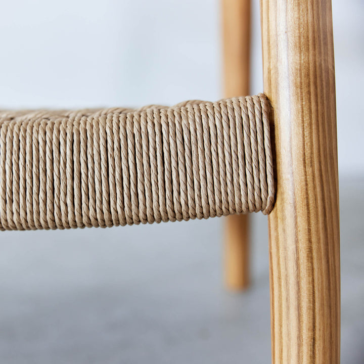 Detail view of the Goldfinger Vale lounge chair made from sustainable cherry, handcrafted
