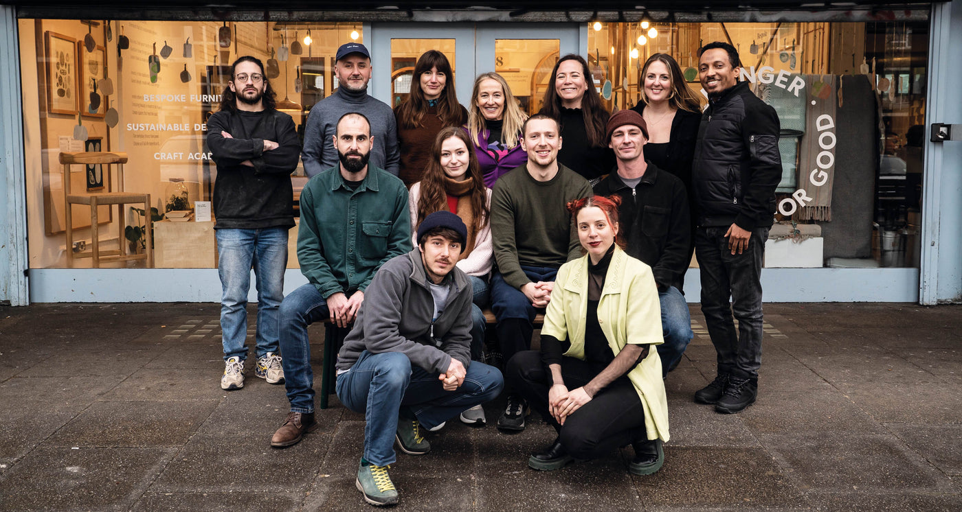 The Goldfinger team in front of the showroom under Trellick Tower