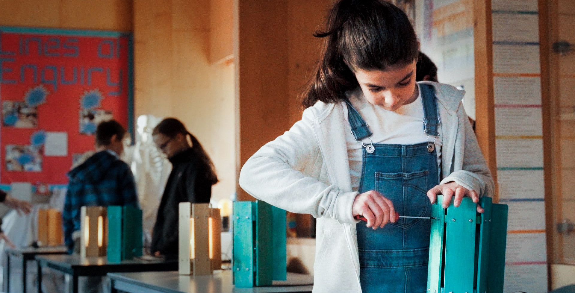 A Manufacto participant builds a wooden design object